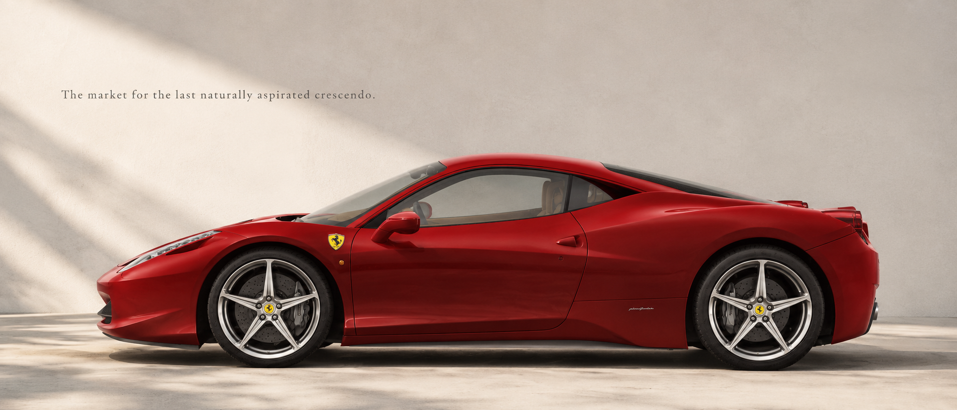 Red Ferrari 458 Italia in side profile beneath soft architectural light